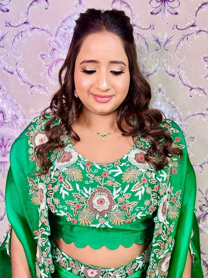 A soft and pretty shot, highlighting the shimmering eye makeup and the client's happy expression.