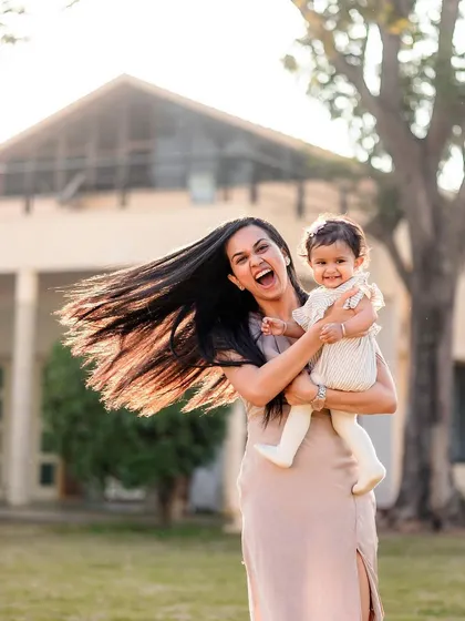 A moment of pure happiness between a mother and her baby girl. We used the golden hour light to capture the warmth and energy of this connection during a relaxed mother and daughter portrait session. The hair flip was just a bonus!