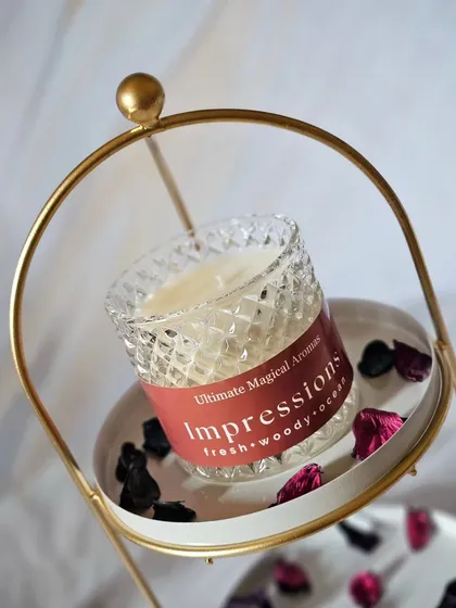 This is the 'Impressions' fragrance in my Crystal Jar. Its fresh, woody, and ocean notes are perfect for creating a clean and inviting atmosphere in your home.