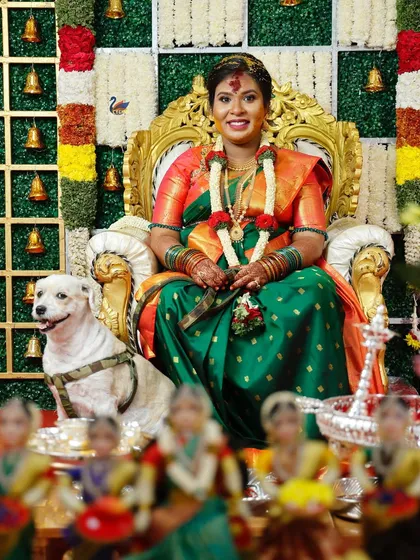 Capturing the grandeur of a traditional baby shower ceremony. This shot shows the mother-to-be seated like a queen, surrounded by tradition, family, and even the family pet, all part of the celebration.