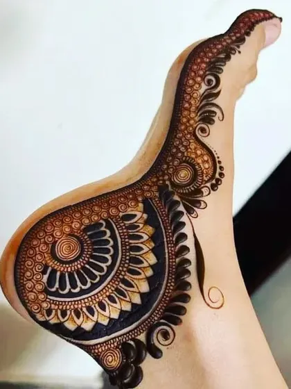 A stylish and modern take on a foot design, with a large paisley pattern that gracefully sweeps along the side of the foot.