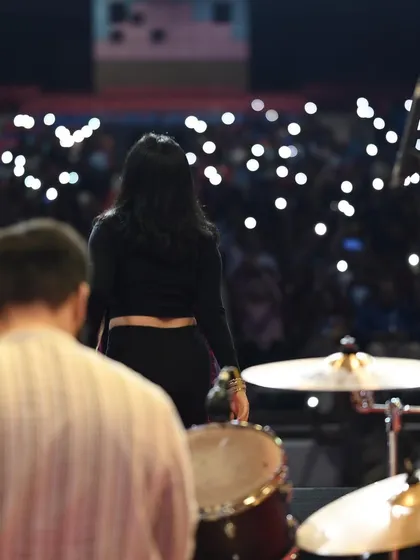 A view from the stage, looking out at a sea of phone lights during a slow song. These are the magical moments that make live music so powerful.