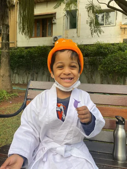 This is the smile of a happy student during one of our outdoor park sessions. We believe in mixing up the environment to keep classes exciting, whether it's in the studio or out in the fresh air.