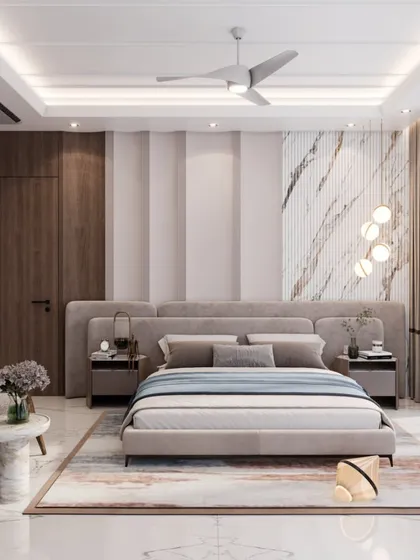 A bedroom design that merges luxury and comfort, featuring a wide upholstered headboard and a mix of textures. The wall combines vertical paneling with a statement marble accent for a modern, elegant look.