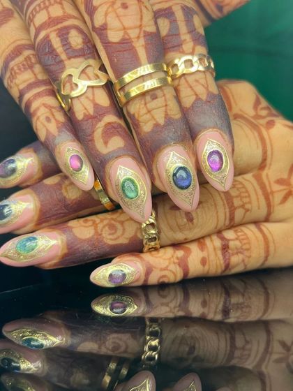 Another view of the incredible gemstone nail art, showcasing the detail and artistry.