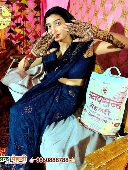 A happy client posing with her beautiful mehndi and a Manpasand Mehndi bag. We love it when our clients become our brand ambassadors.