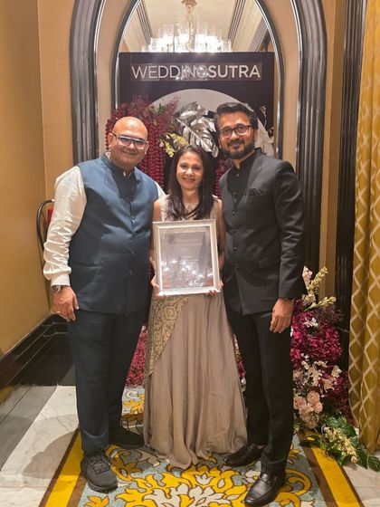 The team celebrating with our award. Teamwork is the secret ingredient to our success, and we are so proud of what we have achieved together.