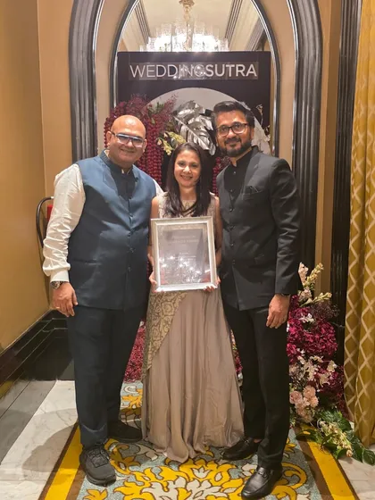 The team celebrating with our award. Teamwork is the secret ingredient to our success, and we are so proud of what we have achieved together.