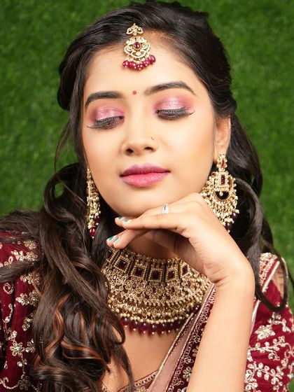 This bride is wearing a beautiful Kundan choker with red bead drops. It's a great choice for a sangeet or mehendi function.