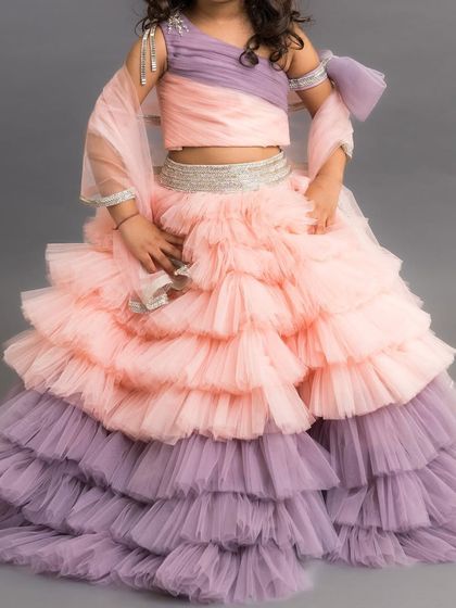 One of our bestsellers, the Alexandra skirt top combines a simple one shoulder top with a dramatic, multi layered ruffled skirt.