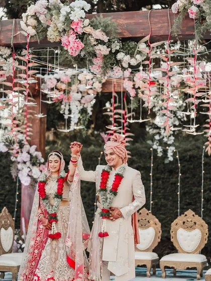 The moment they became husband and wife. This intimate home wedding in Ooty was filled with personal touches, like the hanging floral strings and custom chairs, making the ceremony deeply emotional.
