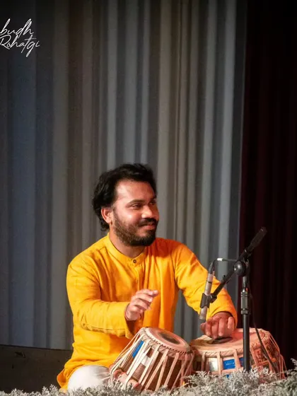 A gallery of cherished moments accompanying the legendary vocalist, Guruji Padma Bhushan Pandit Ajoy Chakraborty ji, at various prestigious festivals.