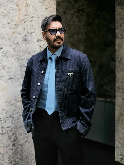 This look for Ajay Devgn at the 'Son of Sardaar 2' trailer launch features a structured Prada denim jacket and a sharp tie, creating a modern and sophisticated statement in menswear.