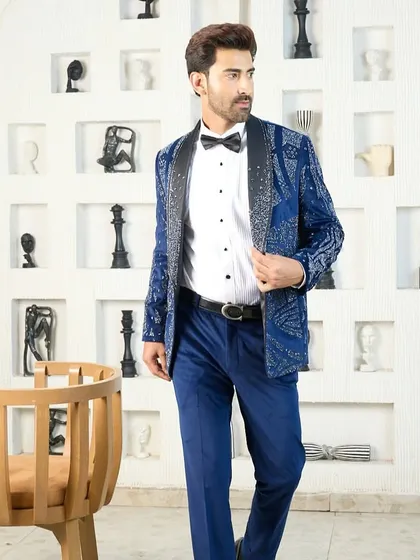 A full-length view of the heavily embellished blue tuxedo, a true showstopper designed for galas, receptions, and red-carpet moments.