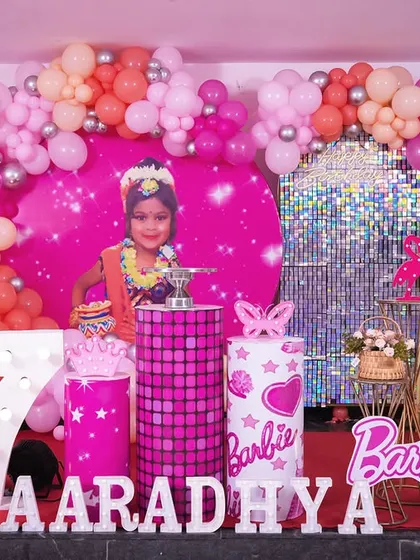 The complete Barbie-themed stage setup, showcasing the vibrant colors and fun details that made this 7th birthday party so special.
