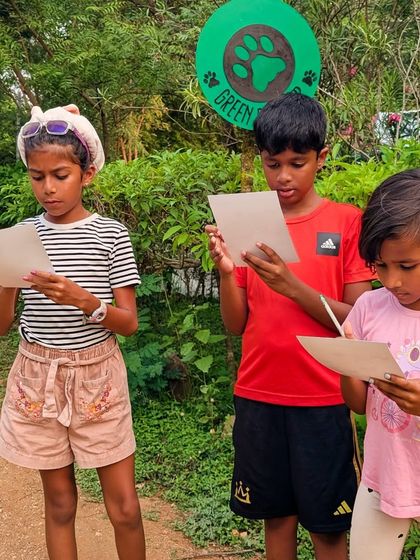 What has these explorers so focused? No screens, just a scavenger hunt list and a world of tiny treasures waiting to be found.