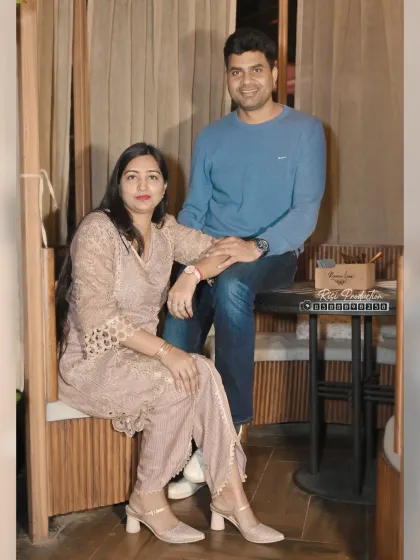 A couple takes a moment for a posed photo during a party. We ensure our clients get a variety of beautiful portraits from their event.