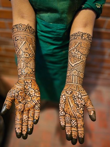 A very intricate and dense bridal design, perfect for the bride who wants maximum coverage.