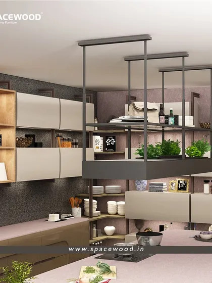 I designed this kitchen with an overhead hanging storage unit that defines the island area. This solution keeps essentials within reach while maintaining an open feel, complemented by handleless cabinets and built-in shelving.
