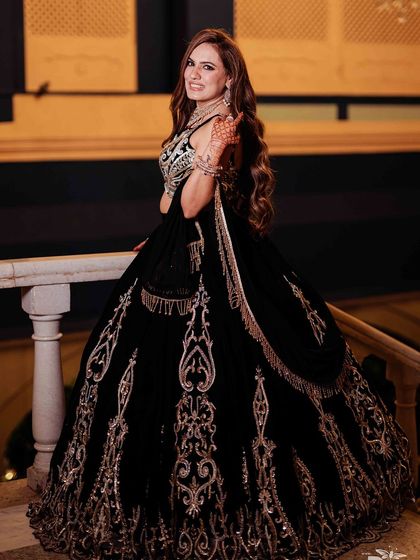 A playful and happy shot. Her makeup looks flawless even in a candid moment.