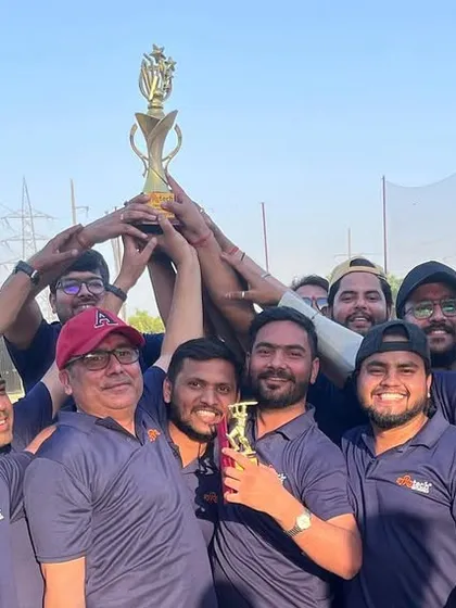 The victorious team holding up the trophy after the cricket match. A proud moment for the Syrotech family.