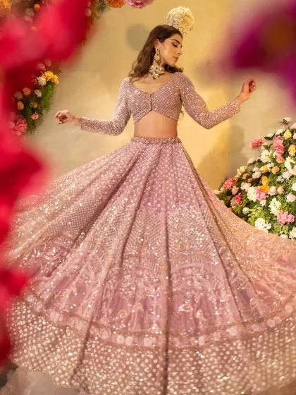 The twirling skirt of this pastel lehenga creates a beautiful, ethereal effect.