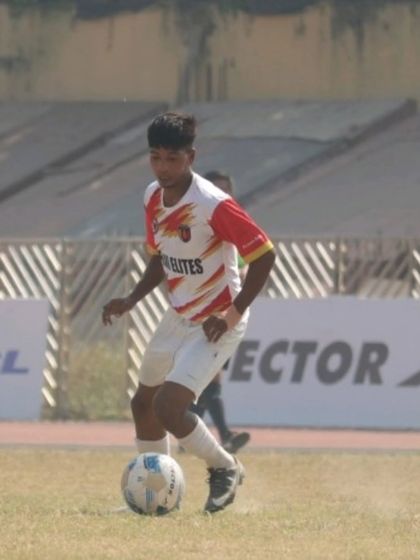 On the ball and in control. An academy player scans the field for his next pass during a Delhi Youth League game.