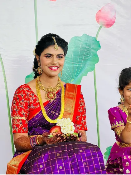 A happy, smiling bride holding flowers during her ceremony. This is the kind of natural, joyful beauty I love to enhance.