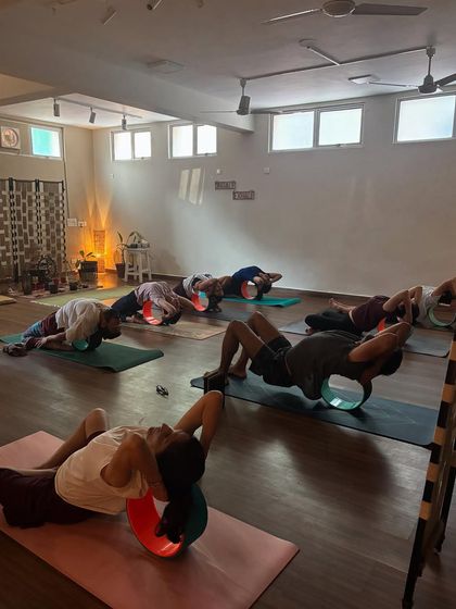 Students using props during a class at the shala. The space is equipped to support practitioners of all levels on their journey.