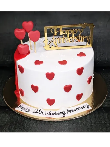 A simple and sweet cake for a 12th wedding anniversary. This fresh pineapple cake is decorated with red hearts to celebrate the special day.