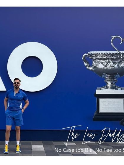 Combining my passions for law and tennis at the Australian Open. My tagline, 'No Case too Big, No Fee too Small,' applies whether I am in a courtroom in Delhi or standing next to championship trophies in Melbourne.