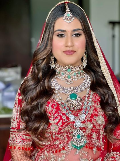 A detailed shot of the makeup for this royal bride. The soft smokey eye and perfectly blended skin create a look that is both glamorous and refined.