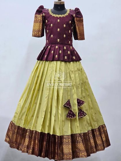 Another look at the elegant wine and lime green Pattu Pavadai, showing the pleated peplum blouse.