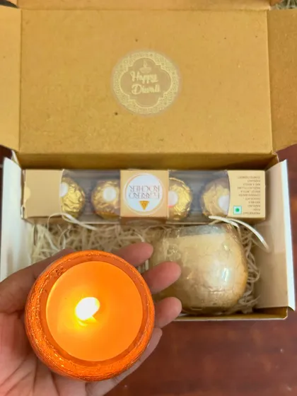 A close-up of one of the scented candles from our Diwali hamper. We take bulk orders and can customize the hampers for you.