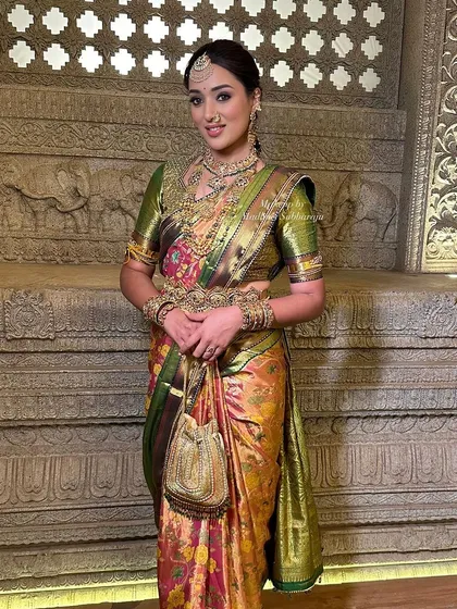 A full-length view of the client in a grand, traditional setting, looking every bit the part of a royal bride.