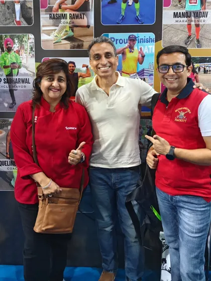 A member with a well-known coach at the expo. We love learning from the best in the business.
