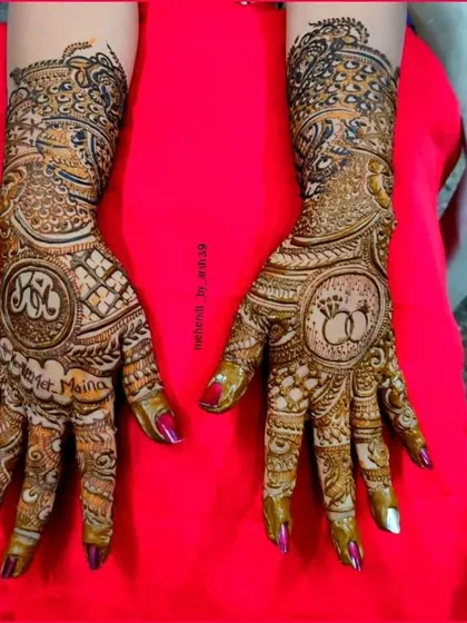 Your mehendi should tell your love story. Here, I incorporated the couple's initials and their engagement rings into the design, making it a truly personal piece of art for their special day.