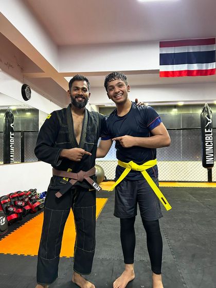 A huge moment for our future champ Almeer. Here he is receiving his Jiu-Jitsu yellow belt promotion, a significant milestone in his martial arts journey.