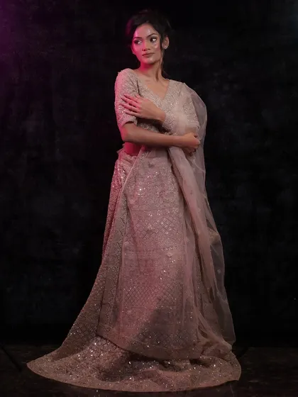 A full view of the model, showcasing how the glass skin makeup makes her look ethereal and stunning.