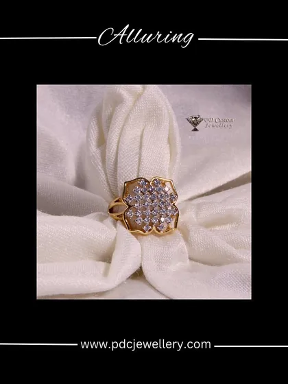 An alluring floral-shaped diamond cocktail ring in 14kt gold. This piece is perfect for adding a touch of glamour and femininity to your look.