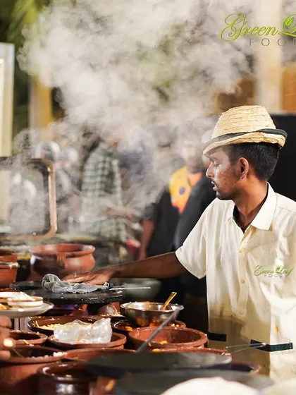 The steam rising from our live cooking stations is a promise of fresh, hot food. Our chefs are trained to manage busy counters efficiently, ensuring every guest gets a taste of the action without a long wait.