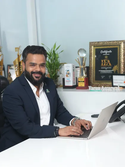 A photo of me at my desk, ready to work on turning your wedding footage into a cinematic masterpiece. The awards in the background are a testament to the quality and creativity I promise to deliver.