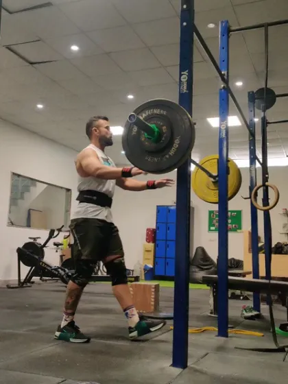 A power snatch in motion. This lift is one of the most technical movements we do, requiring speed, coordination, and mobility.