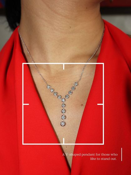 A closer look at our unique Y-shaped pendant, studded with bezel-set diamonds. It's a standout piece for those who like their jewellery delicate yet distinctive.