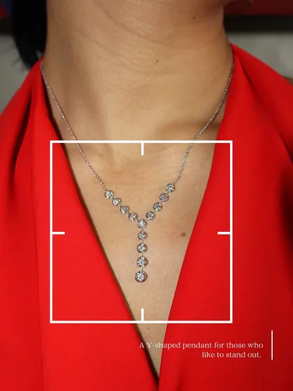 A closer look at our unique Y-shaped pendant, studded with bezel-set diamonds. It's a standout piece for those who like their jewellery delicate yet distinctive.