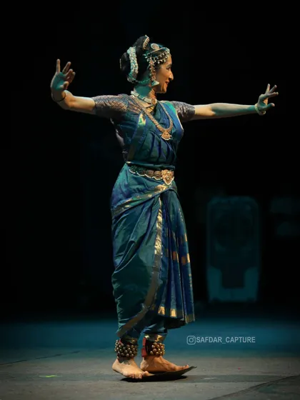 Here I am performing the Tarangam, dancing on the edge of a brass plate. This was part of my recital at the Nishagandhi festival, showcasing a unique and challenging aspect of Kuchipudi.