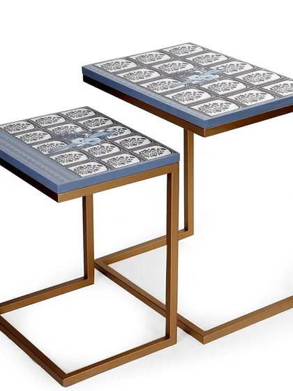 My "Ek Aur Totta" C-stack tables are designed for modern living. They are functional and artistic, featuring a playful parrot motif inspired by a funny moment in my studio. These nesting tables can be used together or separately, bringing a touch of elegance and personality to any corner.