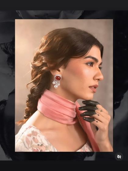 Another shot from the vintage-themed campaign. The side profile highlights the soft contour and the elegant, braided hairstyle.