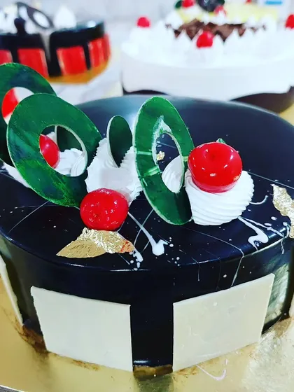 A beautiful chocolate mirror glaze cake from our professional course. You will learn the technique to achieve this flawless, shiny finish.
