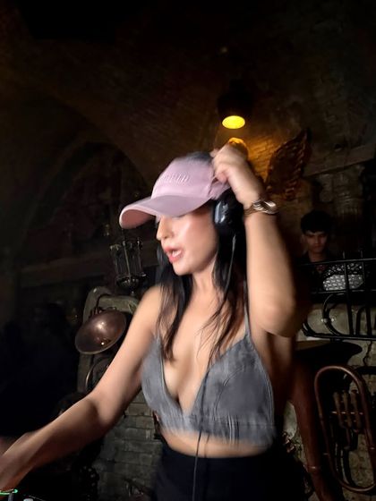 Adjusting my headphones, getting ready for the next track. A simple, focused moment in the middle of a high-energy set.